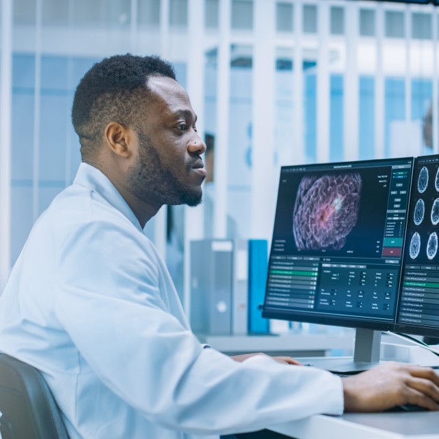 doctor looking at brain scans