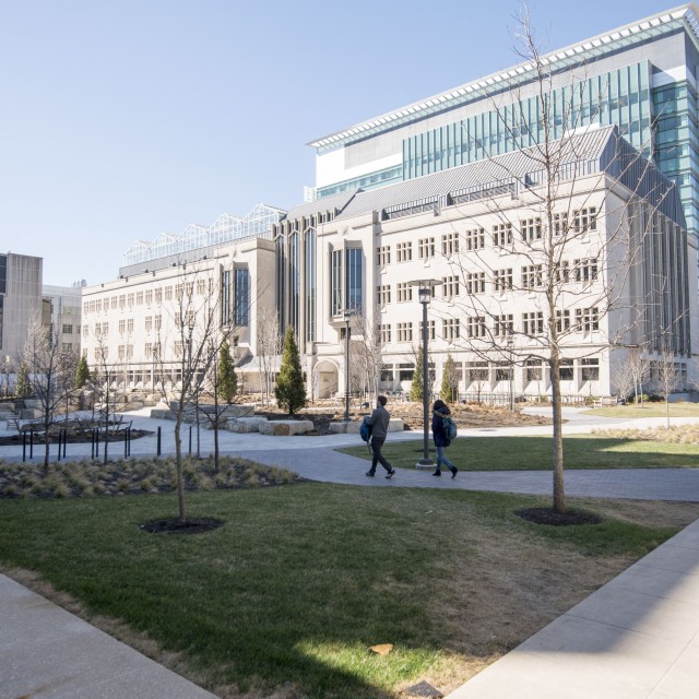 People walking in front of the Biological Sciences Learning Center building on campus