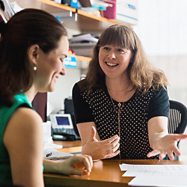 Female administrator consulting a female employee